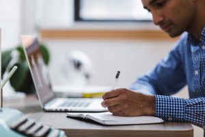 Person working on his desk during a bleisure trip