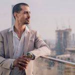 Happy business traveler staying at StayExpress hotel